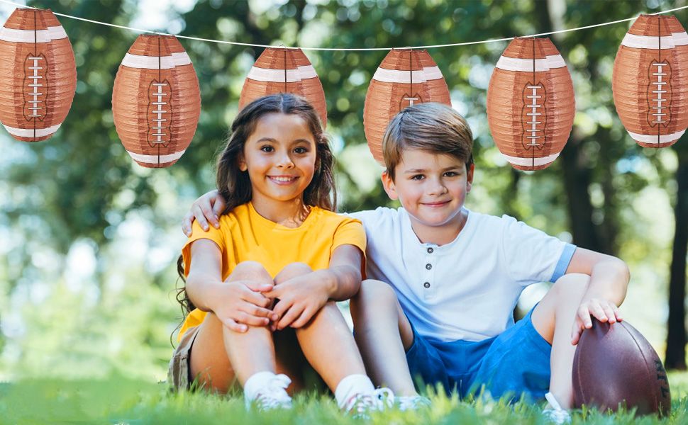 Hanging paper orbs resembling footballs for kids