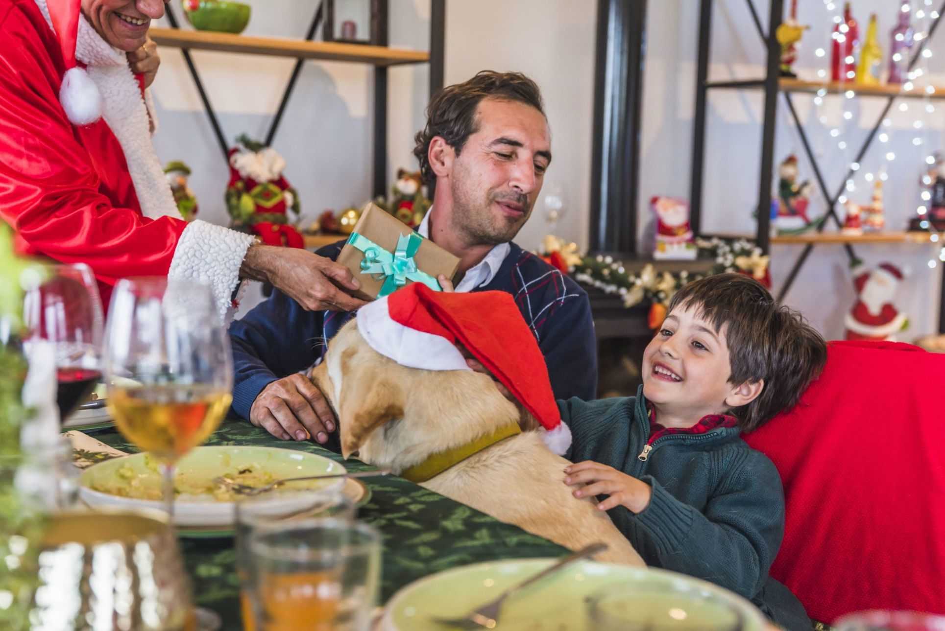 boy taking gift box from santa claus