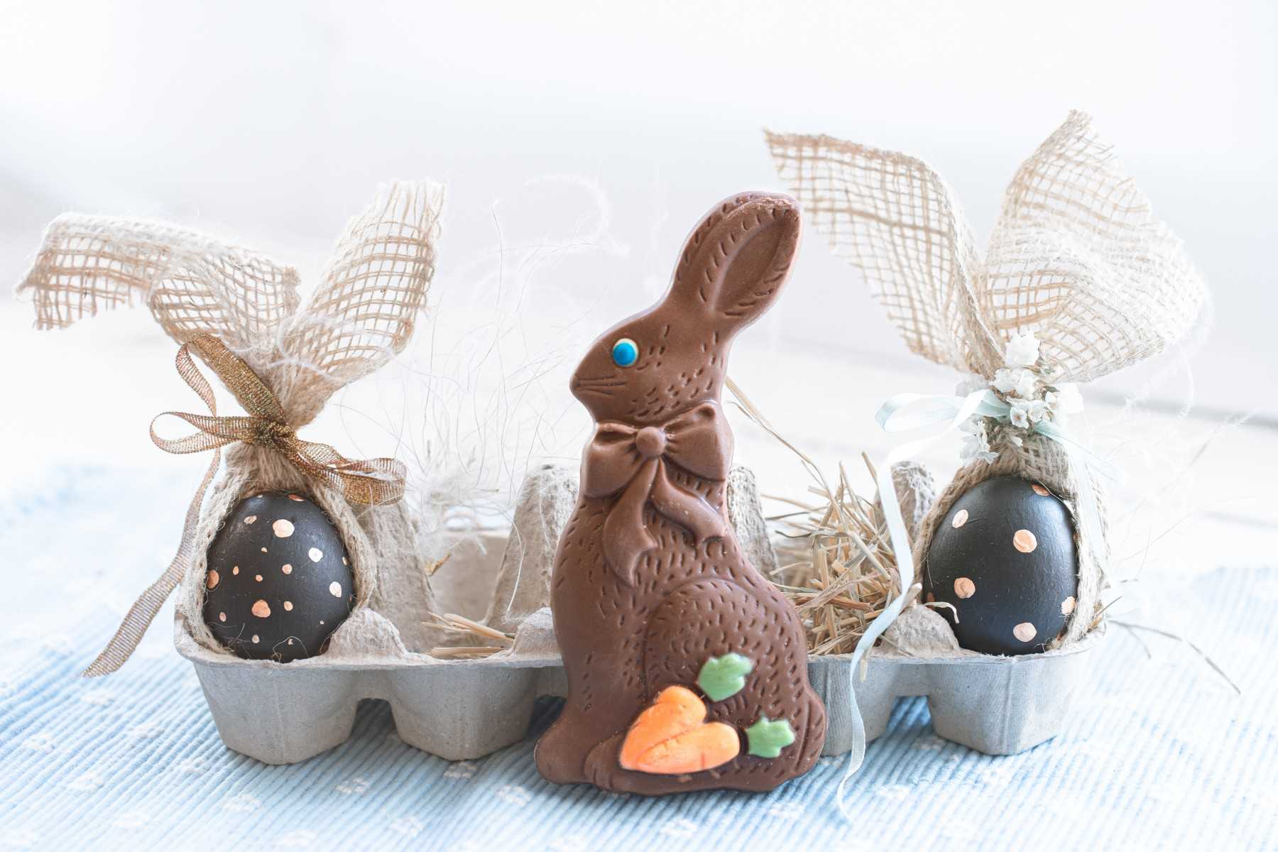 beautiful decorated easter eggs with chocolate bunny