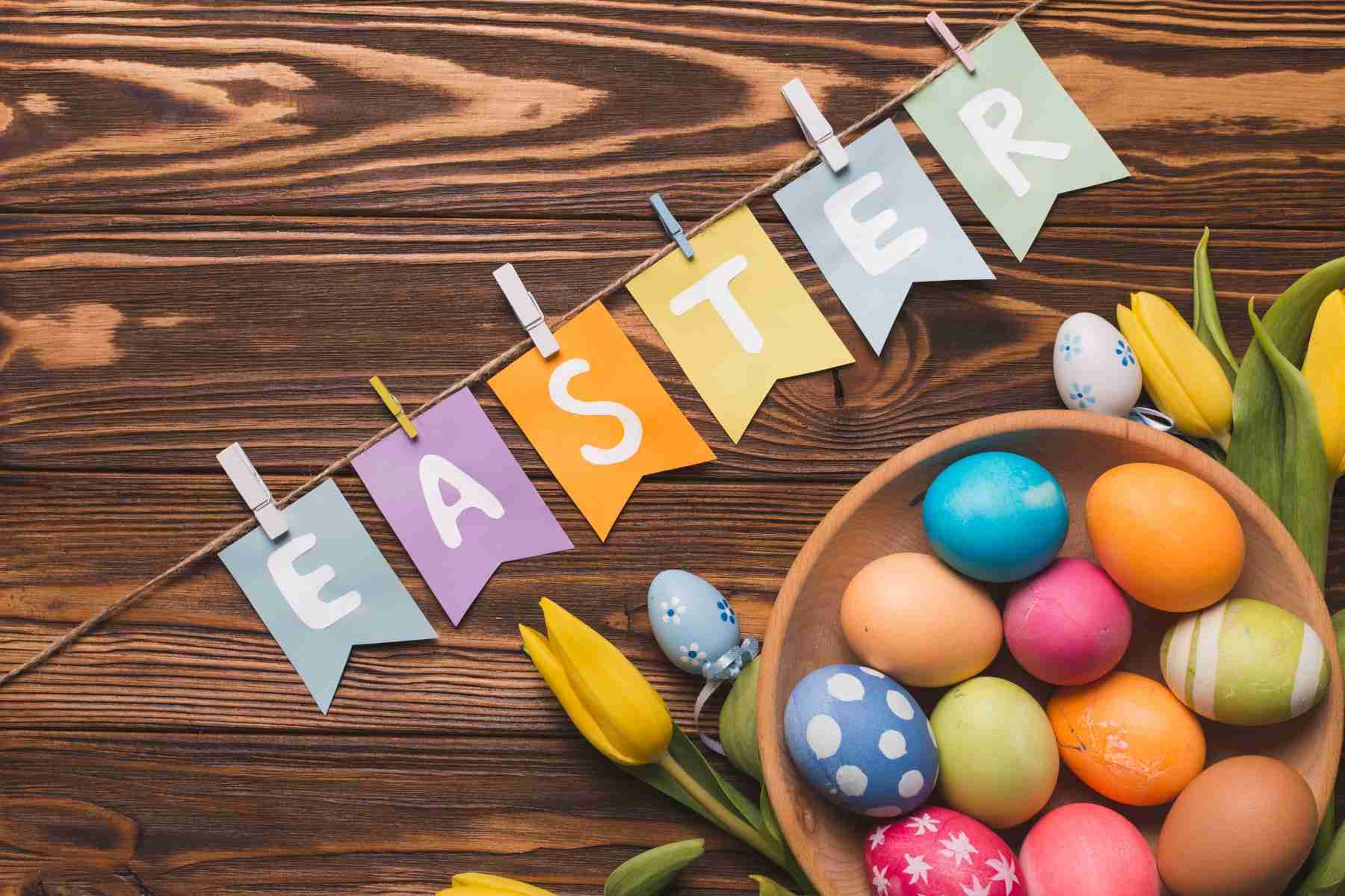 flag with writing near eggs flowers