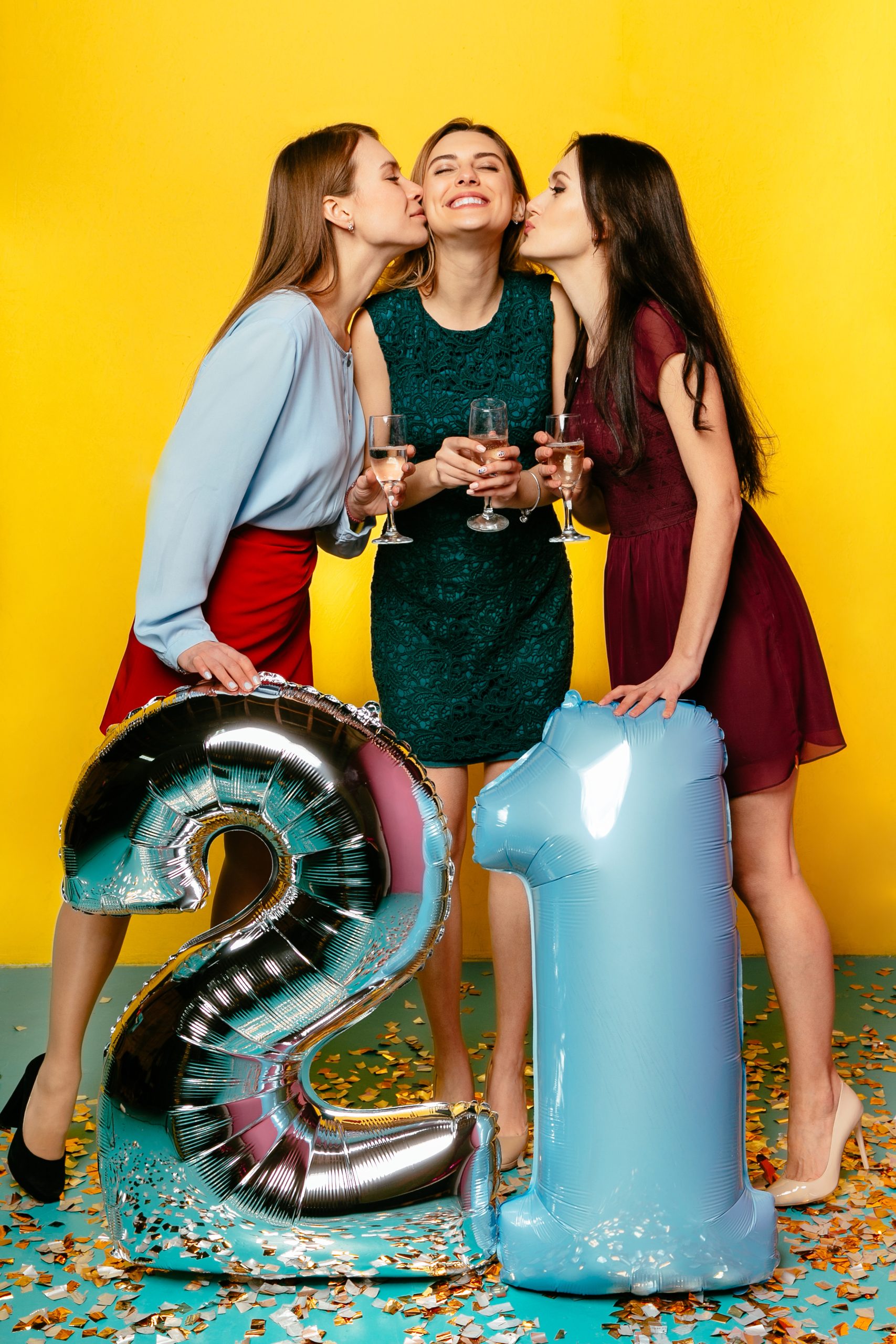 Three girls celebrating birthday party indoors